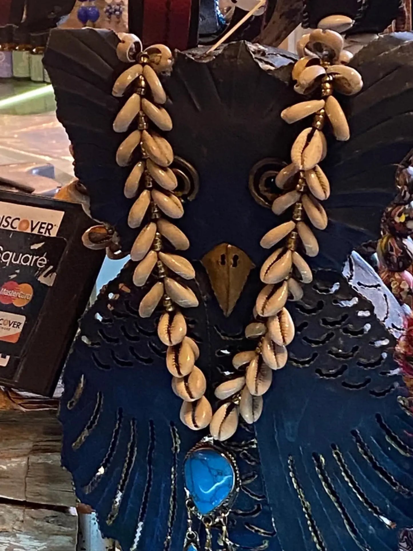 Cowrie shell necklace with turquoise drop