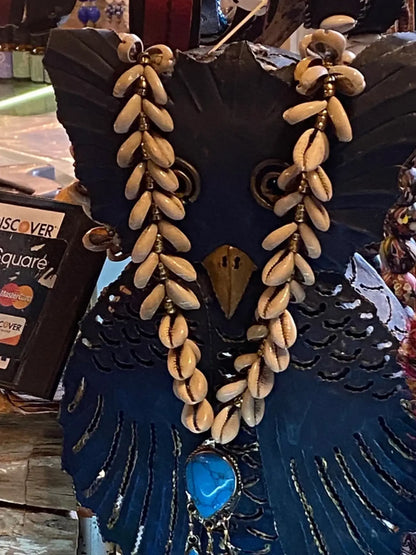 Cowrie shell necklace with turquoise drop